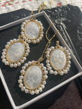 Load image into Gallery viewer, Queen Elizabeth 2 Necklace Mother of Pearl with etched motif and gold plated seed chain .
