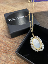 Load image into Gallery viewer, Queen Elizabeth 2 Necklace Mother of Pearl with etched motif and gold plated seed chain .
