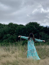 Load image into Gallery viewer, Kaya MAXI DRESS With Tassels, in Pale Blue FLORAL and Birds Print sizes L xl
